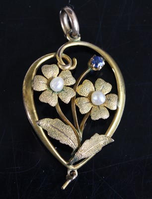 Lot 413 - A yellow metal floral openwork pendant, the...