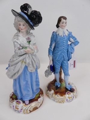 Lot 3 - A pair of continental porcelain figures of a...