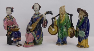 Lot 36 - A Chinese Wucai style figure of a scholar,...