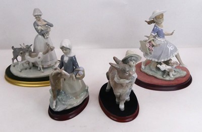 Lot 94 - A collection of four Lladro porcelain figure...