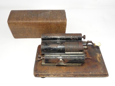 Lot 126 - A vintage Arithmoniter, housed in an oak case,...