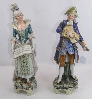 Lot 133 - A pair of continental pottery figures, each...