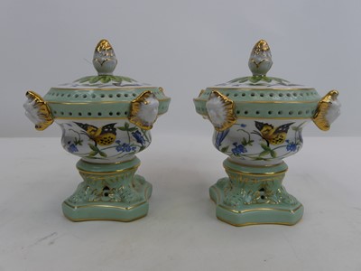 Lot 210 - A pair of continental style porcelain pot...