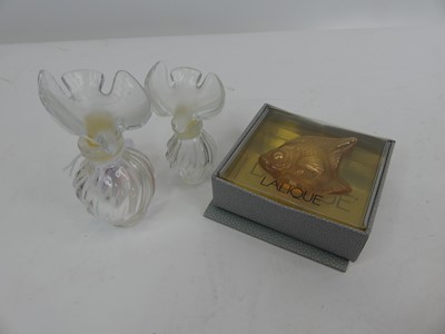 Lot 212 - A graduated set of two Lalique glass scent...