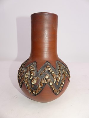 Lot 223 - A Poole pottery vase, having incised geometric...