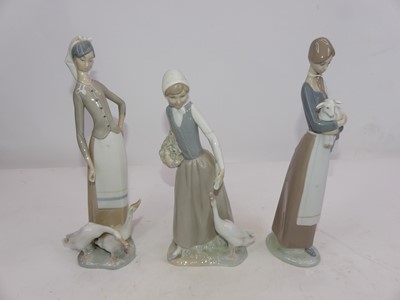 Lot 227 - Two Lladro and one Nao porcelain figures of...