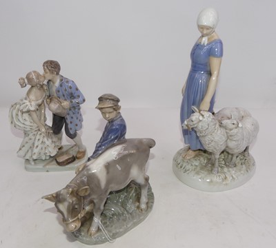 Lot 228 - A Royal Copenhagen porcelain figure of a boy...