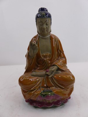 Lot 160 - A Chinese pottery model of the buddha, height...