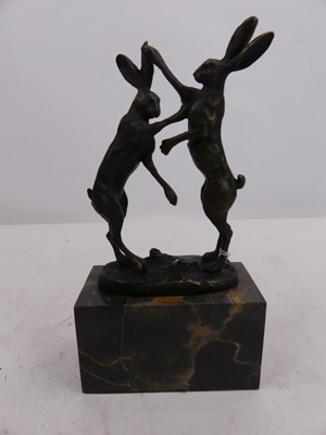 Lot 162 - A bronzed metal boxing hares group, mounted...