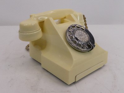 Lot 163 - A vintage cream bakelite rotary telephone