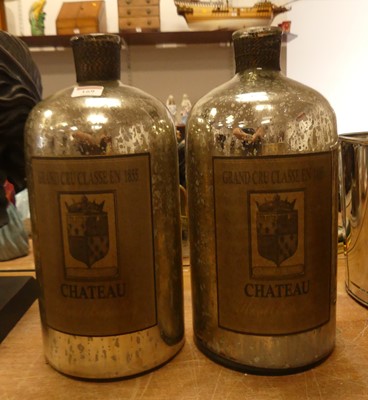 Lot 169 - A pair of silvered glass bottles, each height...