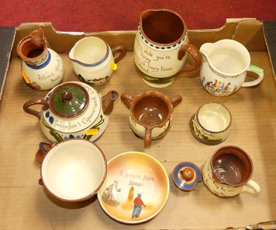 Lot 182 - A collection of Devon pottery motto wares