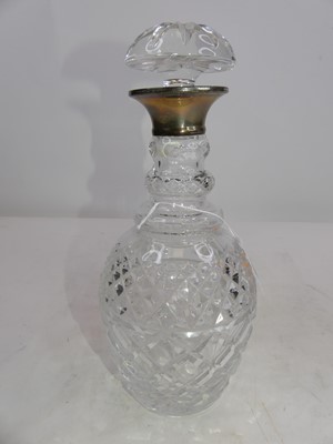 Lot 289 - A cut glass decanter, having a silver collar,...