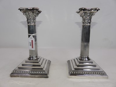 Lot 290 - A pair of silver plated table candlesticks,...