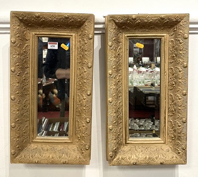 Lot 650 - A pair of cream and gilt painted composite...