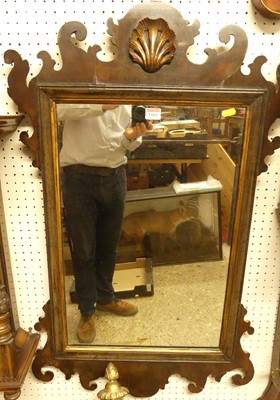 Lot 1163 - A circa 1900 walnut fret carved wall mirror,...