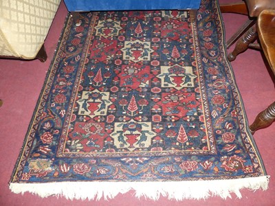 Lot 1167 - A Persian woollen blue ground Tabriz hall rug,...