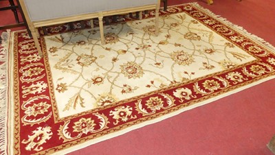 Lot 1168 - A Turkish woollen white and red ground rug,...