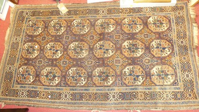 Lot 1169 - A Persian woollen brown ground Bokhara hall...