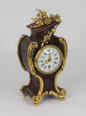 Lot 511 - A 20th century mantel clock in the Rococo...