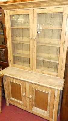 Lot 1195 - A rustic pine dresser, having two-door glazed...