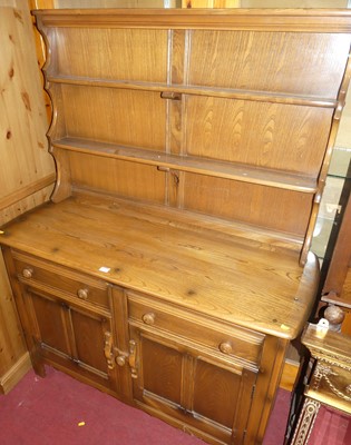 Lot 1199 - An Ercol dark elm dresser, width 120cm