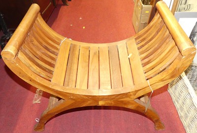 Lot 1212 - An Eastern teak slatted X-framed stool, width...