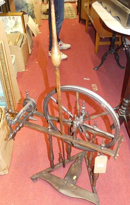 Lot 1217 - A provincial stained wood spinning wheel