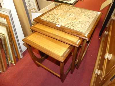 Lot 1223 - A 1960s G-Plan teak and tile topped inset nest...