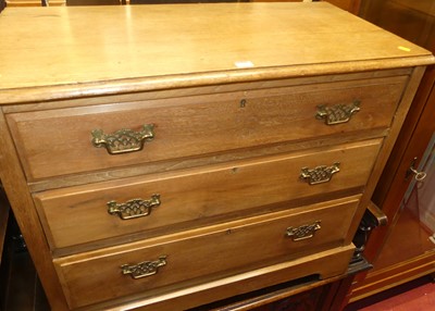 Lot 1238 - An Edwardian walnut and oak topped low chest...