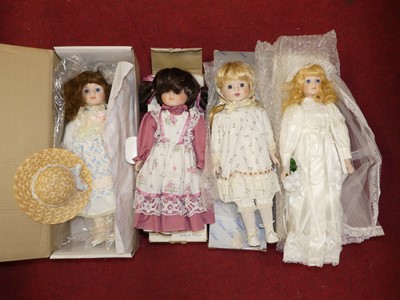 Lot 567 - A group of four boxed dolls, to include a...