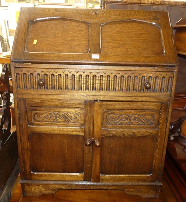 Lot 1265 - A moulded oak slopefront bureau, width 76cm