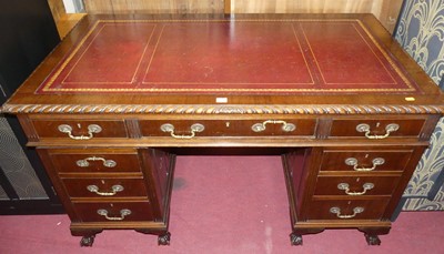 Lot 1280 - An early 20th century mahogany and gilt tooled...