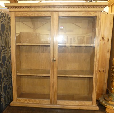 Lot 1282 - A rustic pine double door glazed wall mounted...