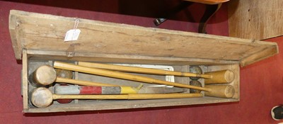 Lot 1295 - A vintage stained pine boxed croquet set