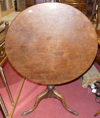 Lot 1299 - A George III mahogany circular tilt-top...