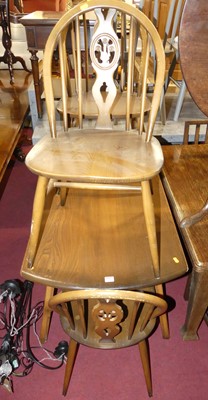 Lot 1300 - An Ercol dark elm breakfast suite, comprising;...