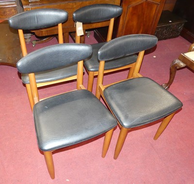 Lot 1375 - A set of four 1960s beech dining chairs, each...