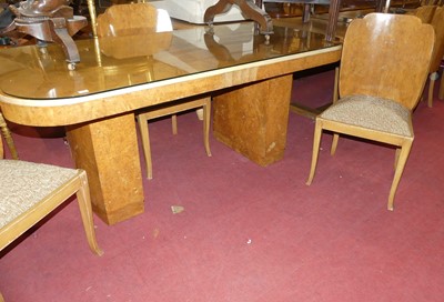 Lot 1318 - An Art Deco figured walnut dining suite,...