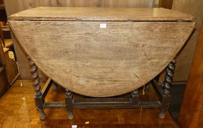 Lot 1383 - An early 20th century oak barleytwist dropleaf...