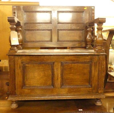 Lot 1387 - An early 20th century twin panelled oak monks...