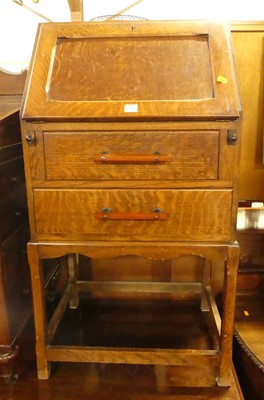 Lot 1389 - A 1930s oak student's bureau, having two lower...