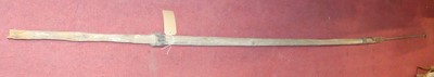 Lot 1395 - A stained pine and iron pole mounted elongated...