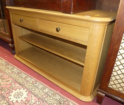 Lot 1399 - A contemporary blond oak open side unit, with...