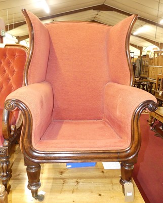 Lot 1337 - An early Victorian mahogany scroll wing back...