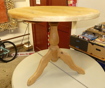 Lot 1340 - A rustic pine ciruclar tilt-top pedestal...