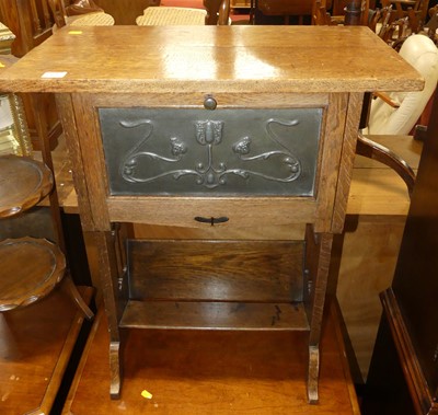 Lot 1408 - An Art Nouveau oak and stylised floral...