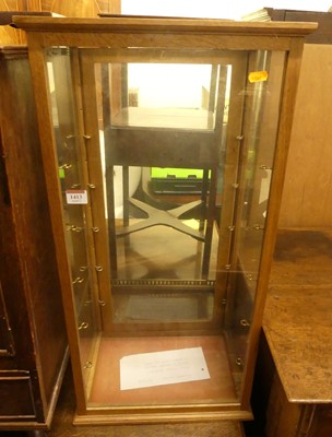 Lot 1413 - A light oak table top shop display cabinet,...