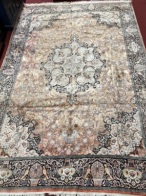 Lot 1437 - A Persian woollen pink ground Keshan rug,...