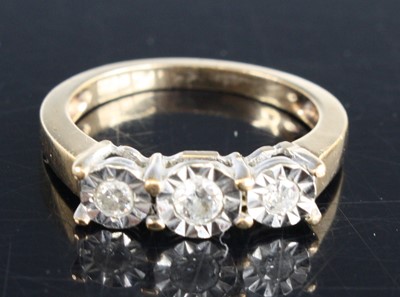 Lot 354 - A 9ct yellow and white diamond three-stone...